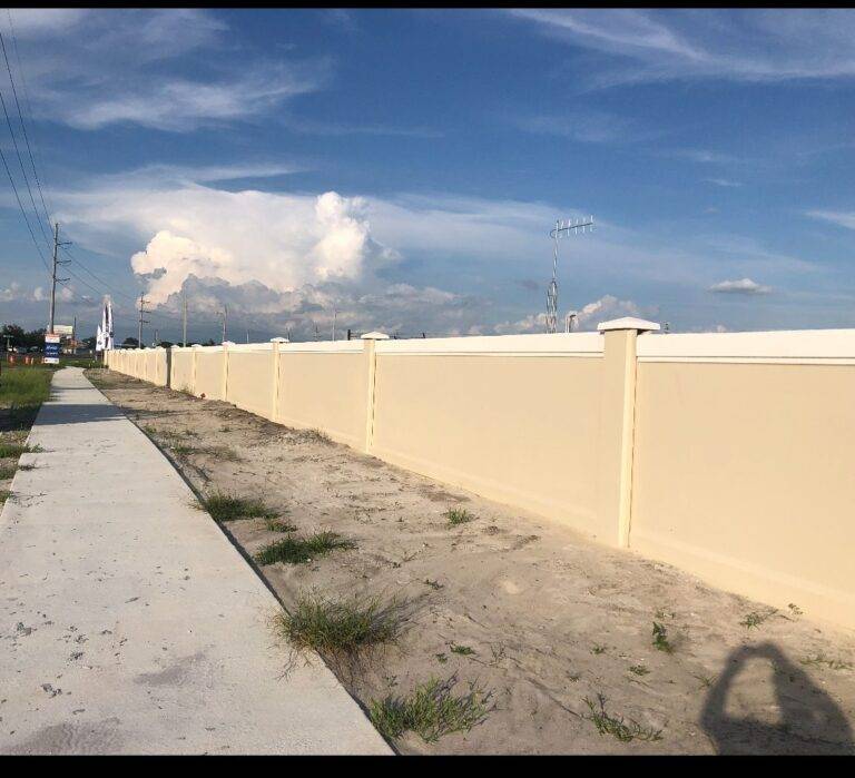 beige precast concrete fence installation