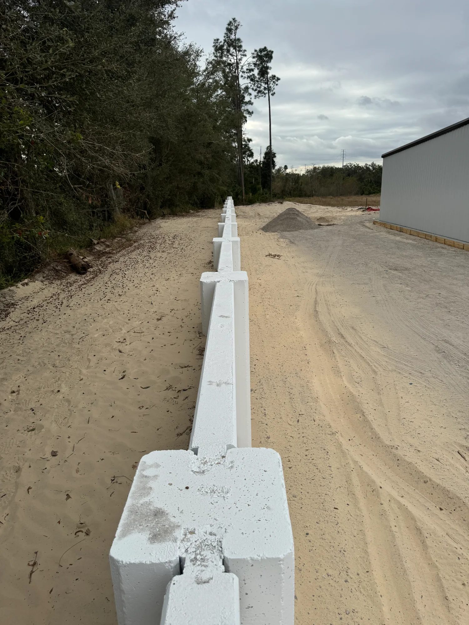 Concrete retaining wall foundation installation and leveling Florida