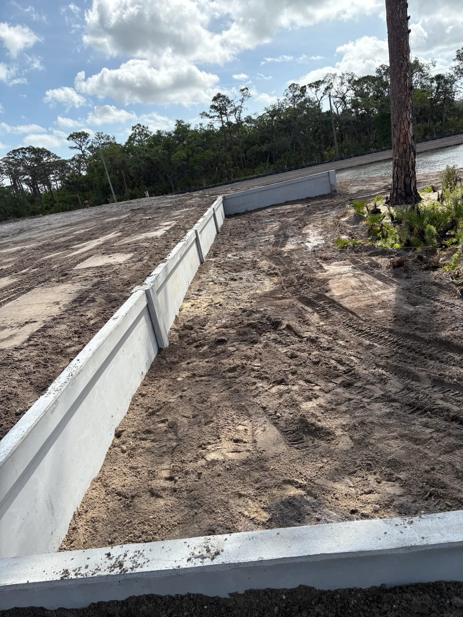 Large-scale precast retaining wall project 8 to 12 feet tall Florida
