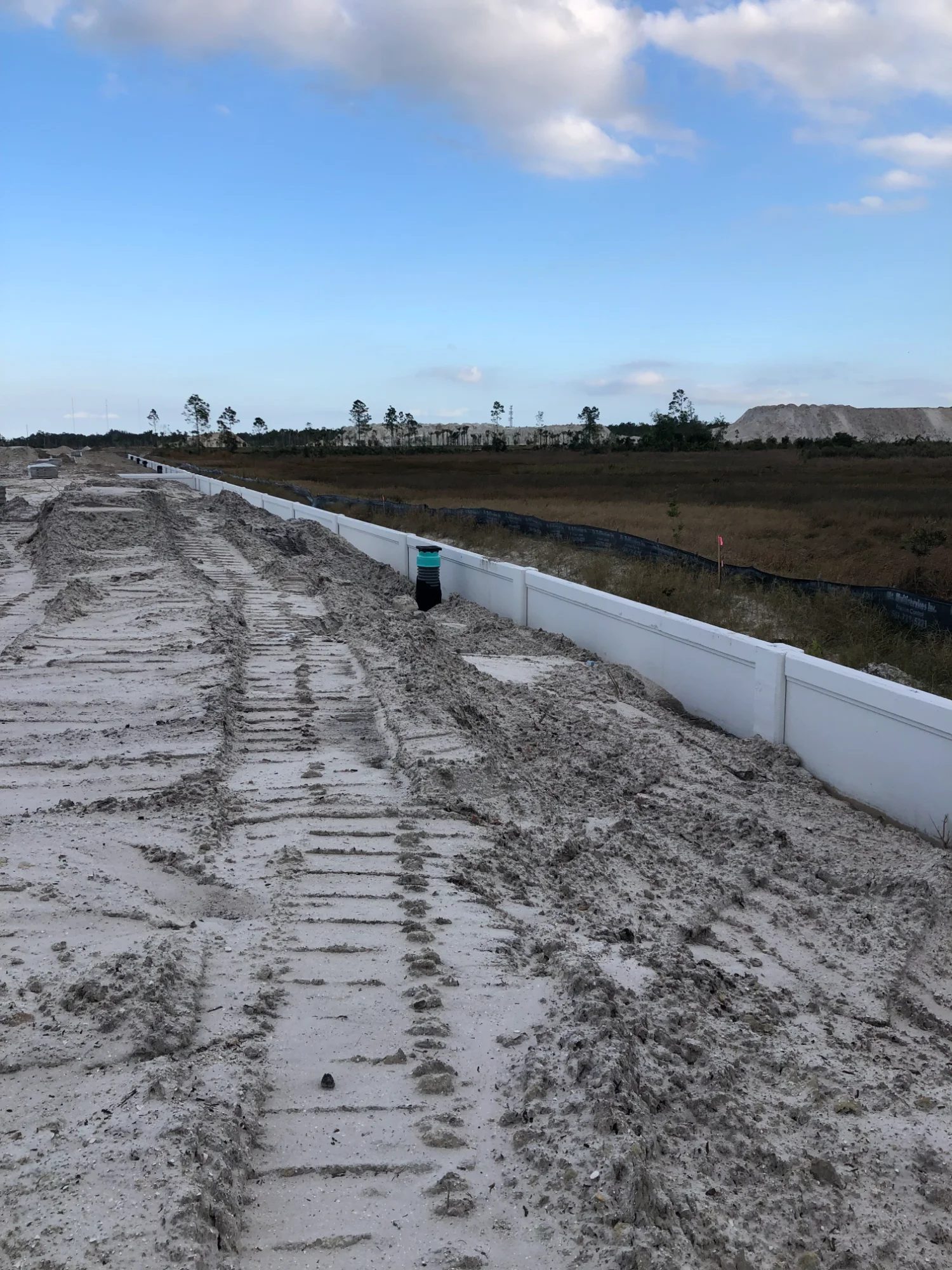 Precast concrete retaining wall construction site panel placement Florida