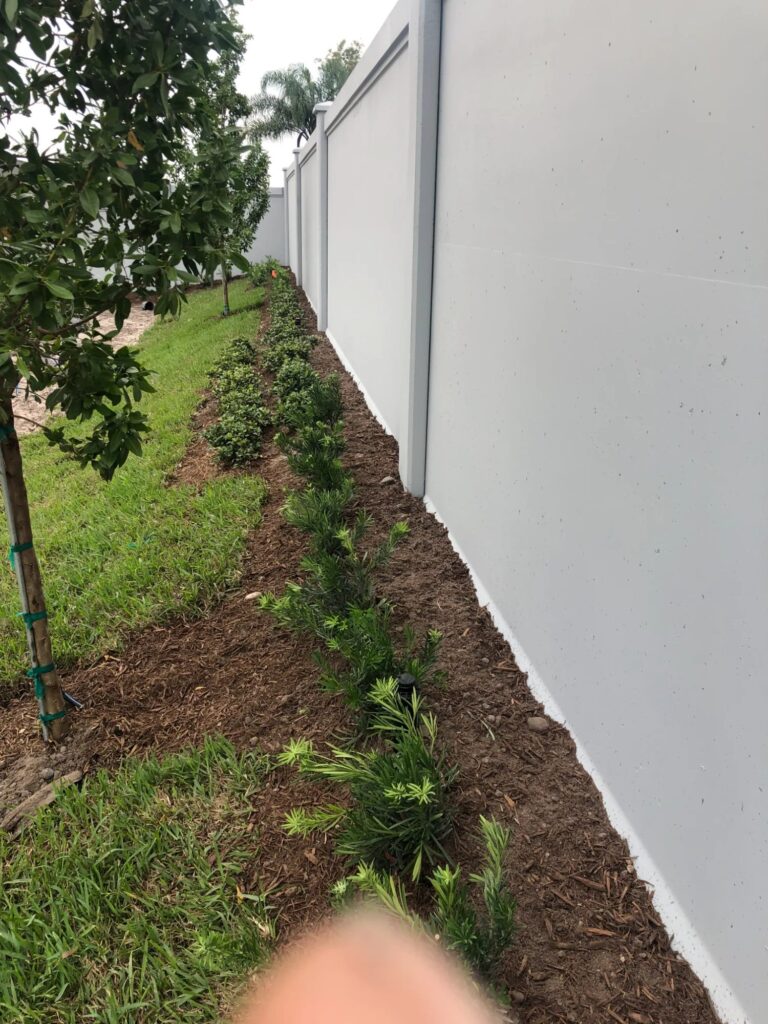 Residential precast privacy walls with landscaping