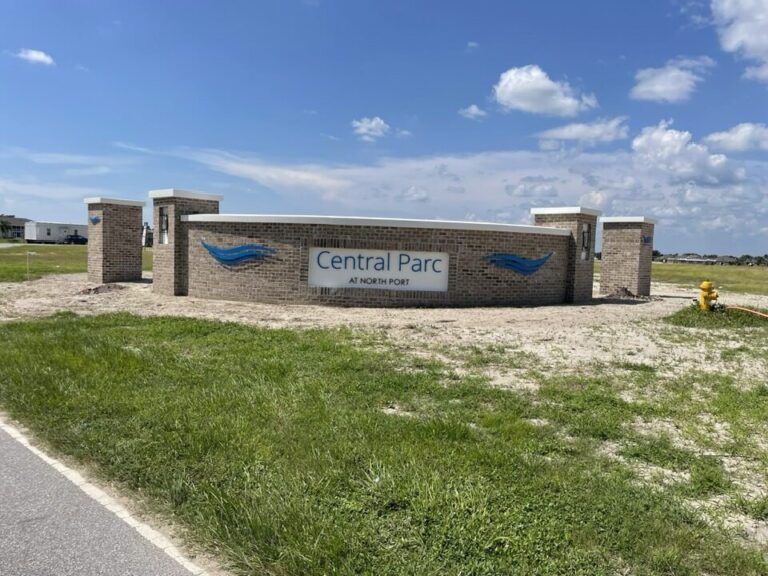 Curved brick monument sign with wave design for Central Parc at North Port Florida