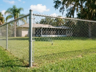 galvanized-chain-link-residential-fence-florida Galvanized chain link fence residential property Florida HOA