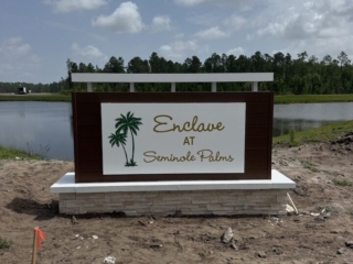modern-monument-sign-enclave-seminole-palms-florida Modern monument sign with white trellis for Enclave at Seminole Palms waterfront community Florida