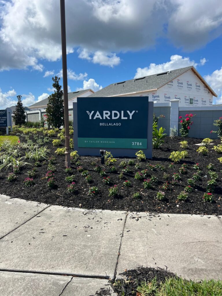 Modern precast monument sign with landscaping for Yardly Bellalago community Florida