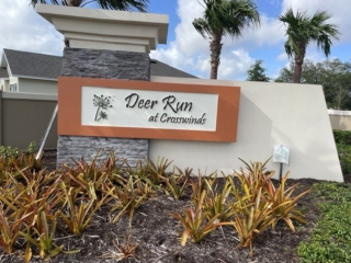 precast-monument-sign-deer-run-crosswinds-florida Precast monument sign with stone column and decorative graphics Deer Run Crosswinds Florida