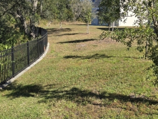 black-aluminum-fence-residential-backyard-curved-florida black aluminum fence residential backyard curved Florida