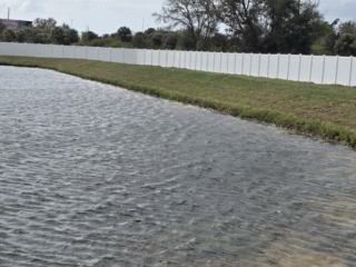 white-vinyl-fence-pond-perimeter-florida white vinyl fence pond perimeter Florida